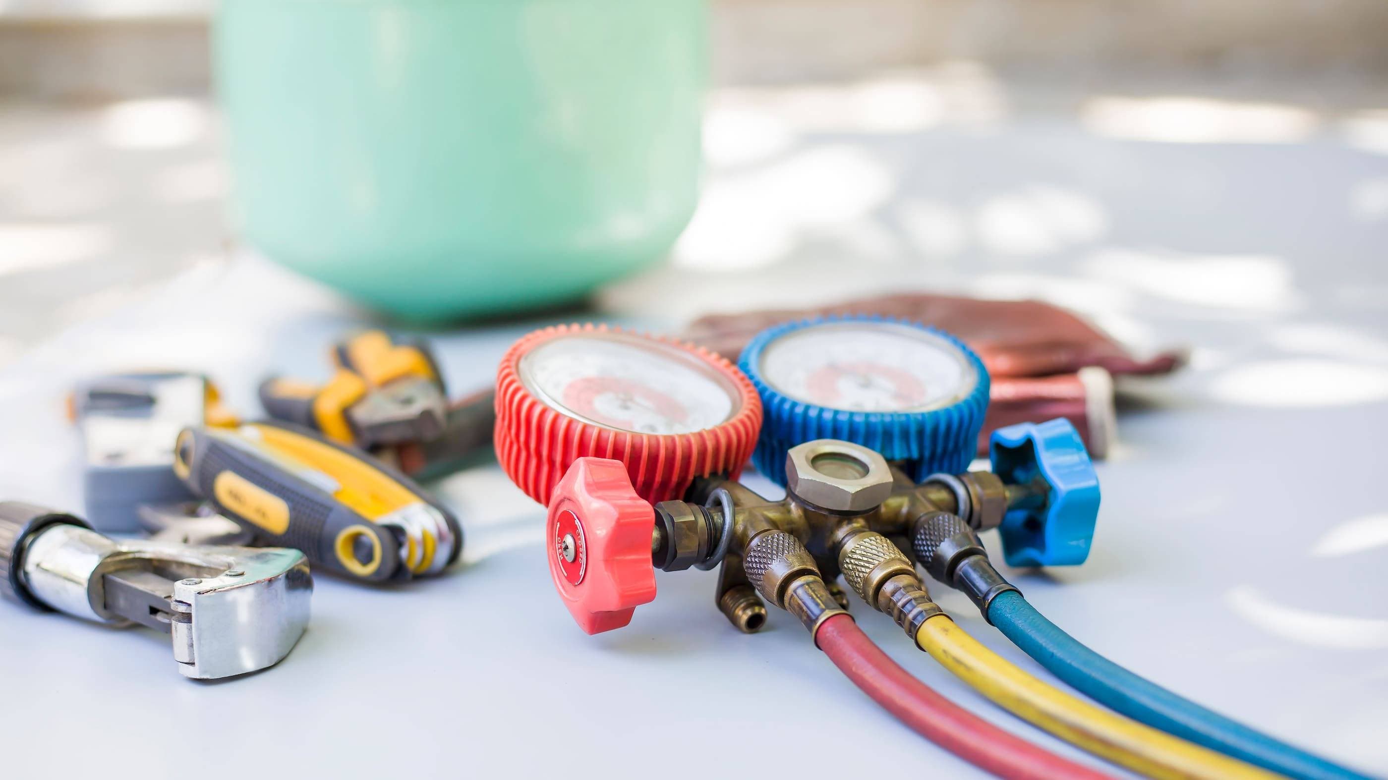 A group of tools and gauges on a table.