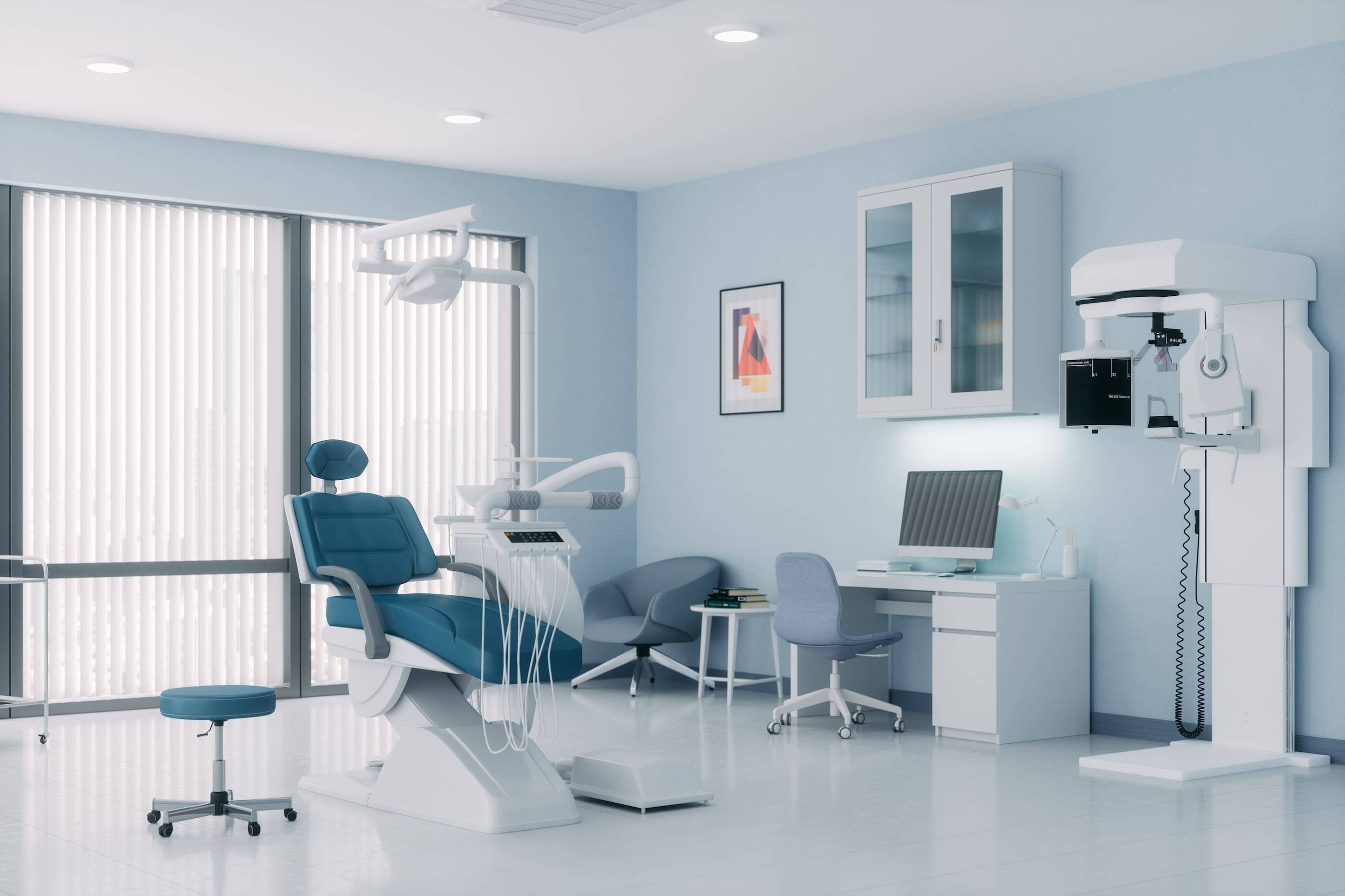 A dentist's office with a chair and a monitor.