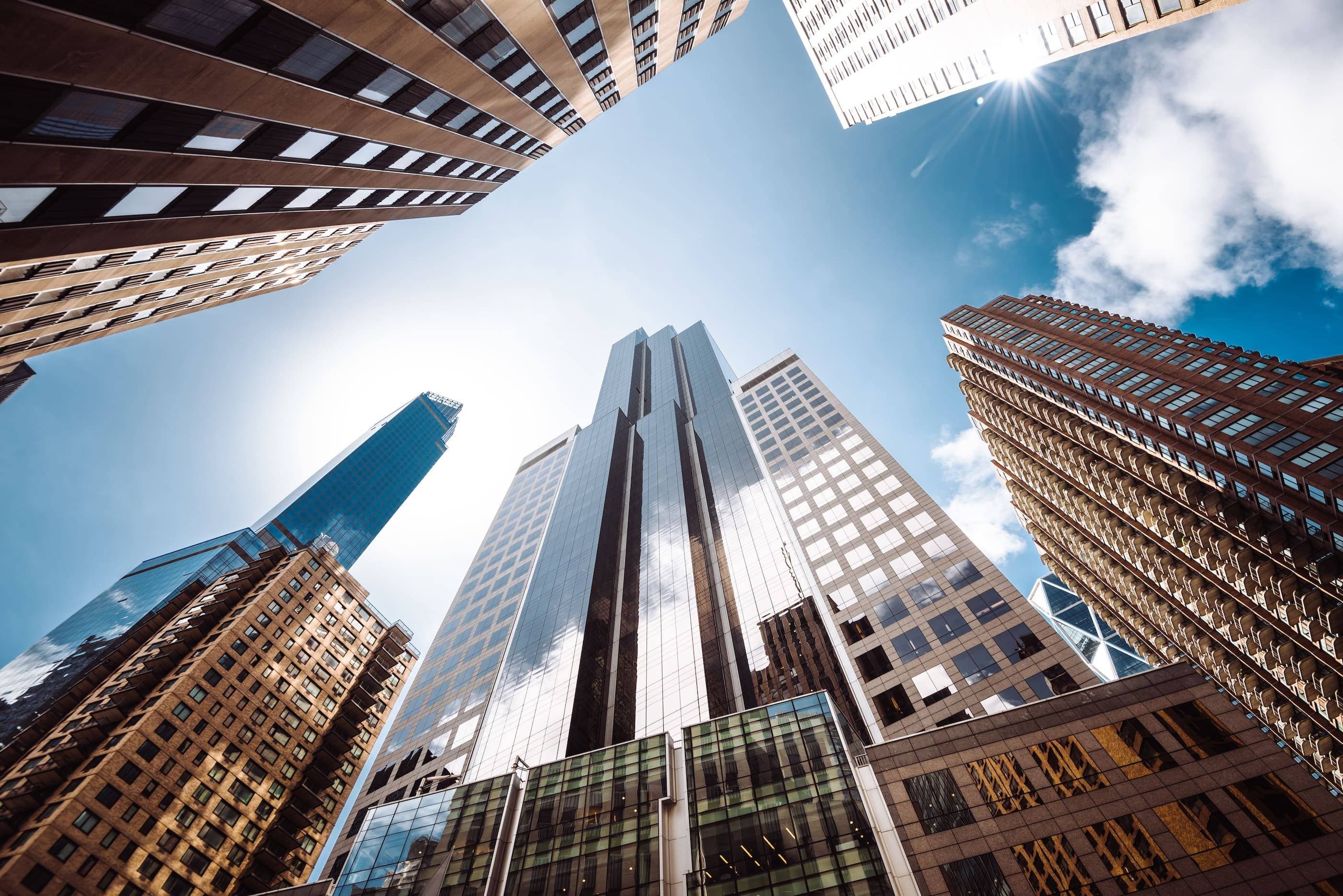 A view of tall buildings in a city.