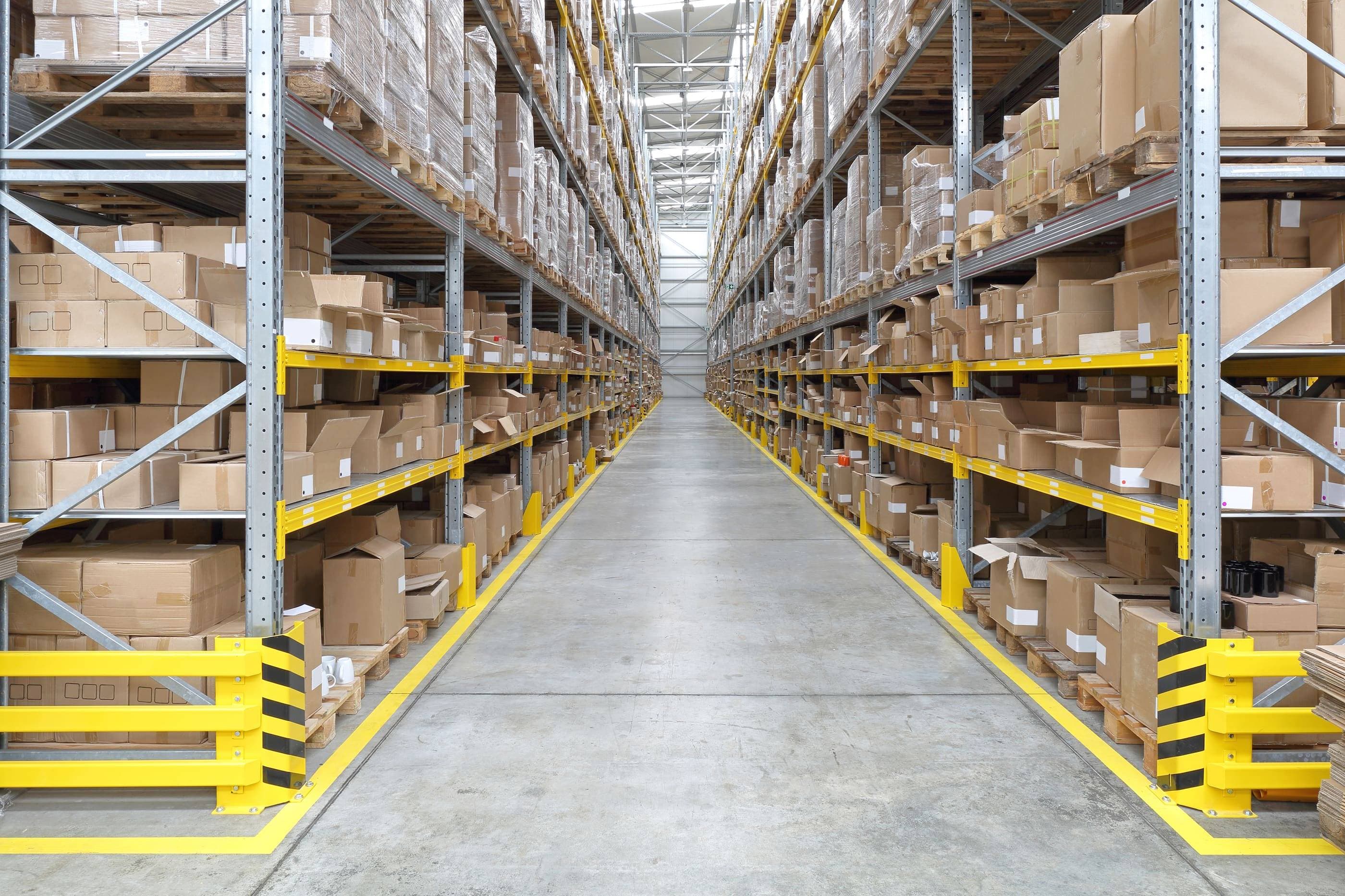 A warehouse filled with boxes and pallets.