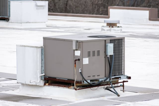 An air conditioning unit on top of a building.