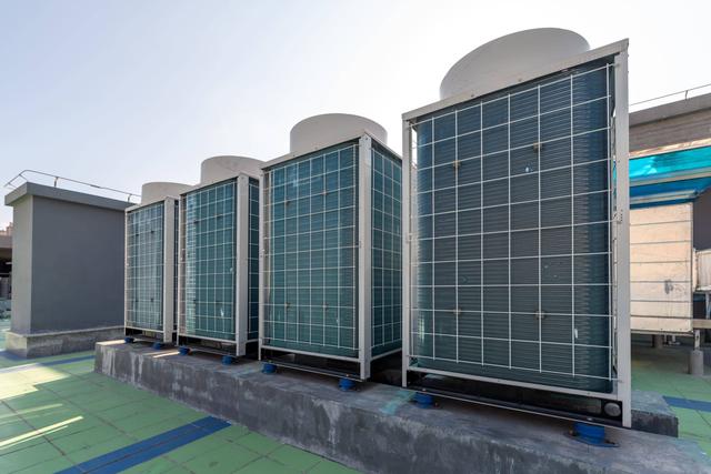 A row of air conditioners in a building.